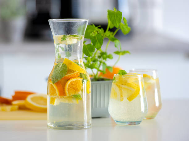 Preparing homemade lemonade from lemons and oranges is a refreshing activity
